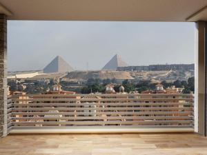  شقة 200م بفيو بانورامي علي الاهرامات في كمبوند pyramids wales للبيع بالتقسيط